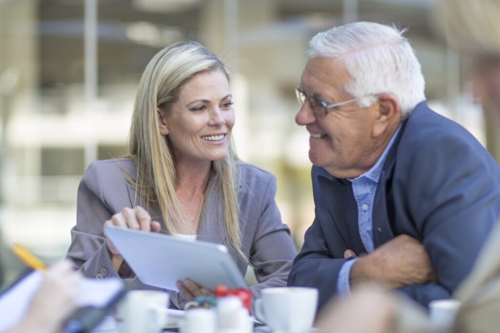 businesswoman and man talking at coffee break on h 2026 01 09 10 51 06 utc 1 scaled.jpg